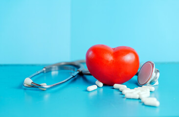 Heart Health and World Heart Day Concept Cardiovascular car, stethoscope and medicine