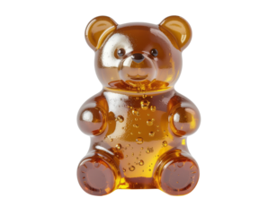 A cute, amber-colored gummy bear candy with a glossy surface and rounded features.