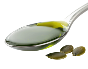 A shiny spoon holds a glossy green liquid alongside several small seeds.