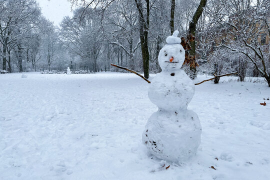 Classic Snowman in Berlin Kreuzberg on a snowy winter day at Grimmstrasse park. 