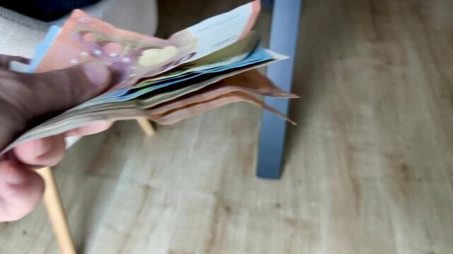 Person Lending Money to Another Person