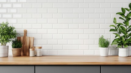 The built-in kitchen cabinet set in modern grey displays an assortment of household products on a blank and empty countertop, set against white ceramic wall tiles