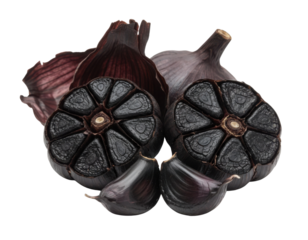 Black garlic bulbs, showcasing their unique texture and dark color, cut open to reveal intricate patterns within.