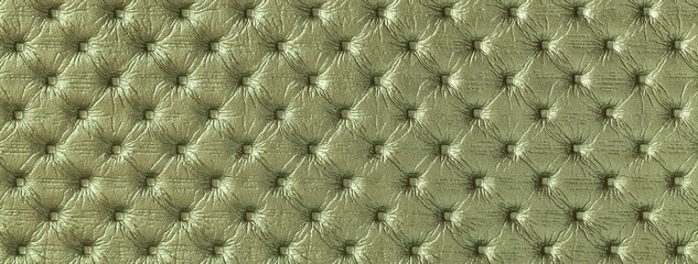 Green leather texture with capitone pattern, macro background of olive retro Chesterfield vintage textile fabric