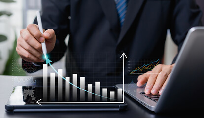 Businessman analyzing growth charts for new year business targets, focusing on strategic goal setting, performance planning, and long-term investment success for future expansion.