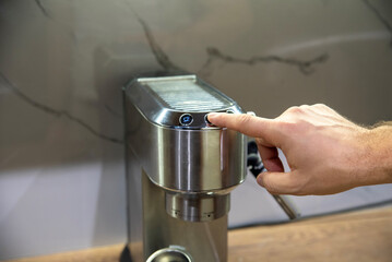 Stainless steel coffee machine with hand pressing button