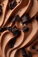 Creamy chocolate ice cream with dark chocolate chunks macro texture closeup.