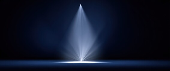 Dramatic spotlight beam against dark backdrop for visual focus and emphasis