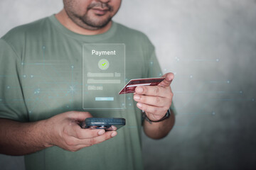 Man using credit card for online payment with digital payment icons on screen. Online shopping, internet banking or purchase