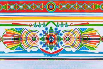 Colors of a chiva. Geometric shapes in different vivid traditional colors used in coffee transport in Colombia.