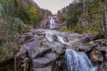 High waterfall around Hotel Pont d'Espagne on trail from Cauterets to lake Lac de Gaube. Pyrenees National Park, France