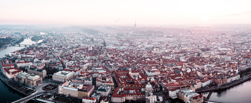 Prague Old Town, Charles Bridge, and Red Rooftops at Golden Hour Sunrise &ndash; Aerial View