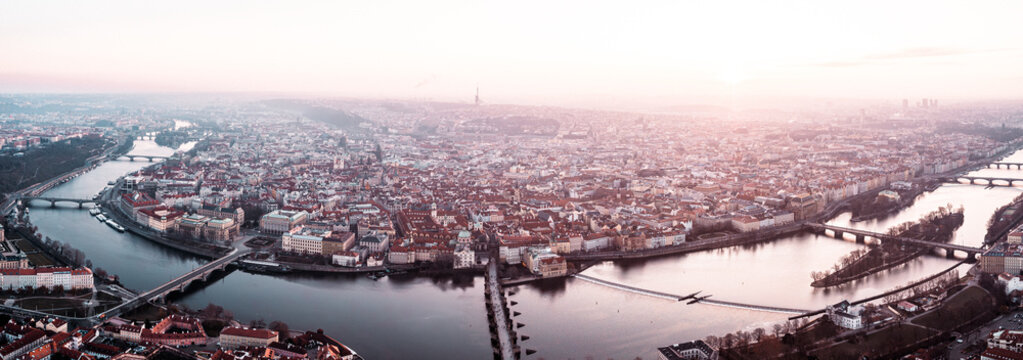 Prague Old Town, Charles Bridge, and Red Rooftops at Golden Hour Sunrise &ndash; Aerial View
