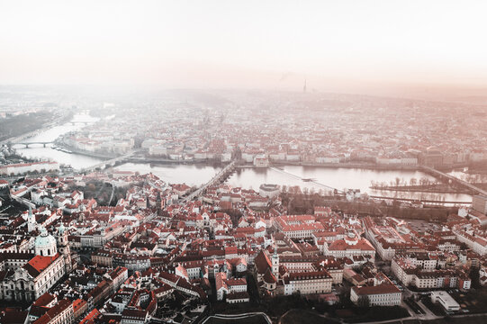 Prague Old Town, Charles Bridge, and Red Rooftops at Golden Hour Sunrise &ndash; Aerial View