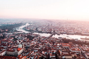 Prague Old Town, Charles Bridge, and Red Rooftops at Golden Hour Sunrise – Aerial View