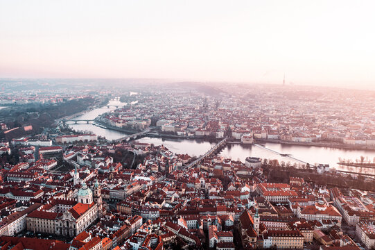 Prague Old Town, Charles Bridge, and Red Rooftops at Golden Hour Sunrise &ndash; Aerial View