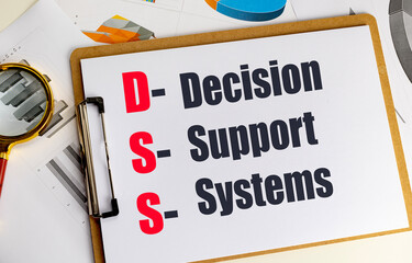 Clipboard with text dss decision support systems on charts and documents with magnifying glass