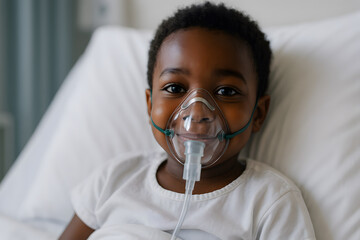 A young child lying on a hospital bed, wearing a transparent oxygen mask, eyes bright and smiling gently