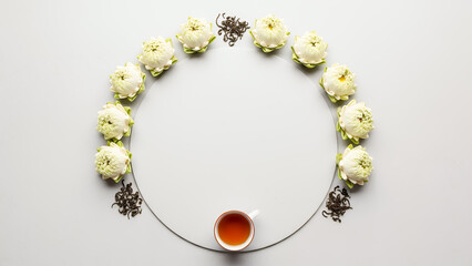 Elegant white Qingming festival background with round copyspace background and symbolic tea arrangement. Calm spring design background with space for text