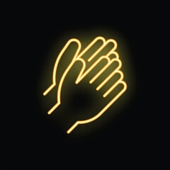 Neon sign showing two hands clapping making a warm bright yellow glow