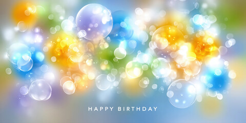 Bright colorful bokeh lights background with happy birthday text for celebration cards.

