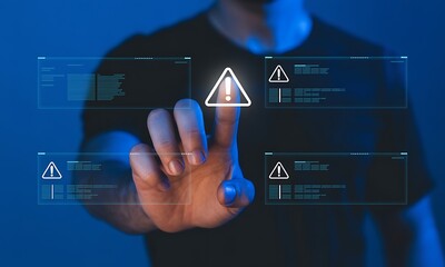Man interacting with futuristic digital interface displaying warning notifications