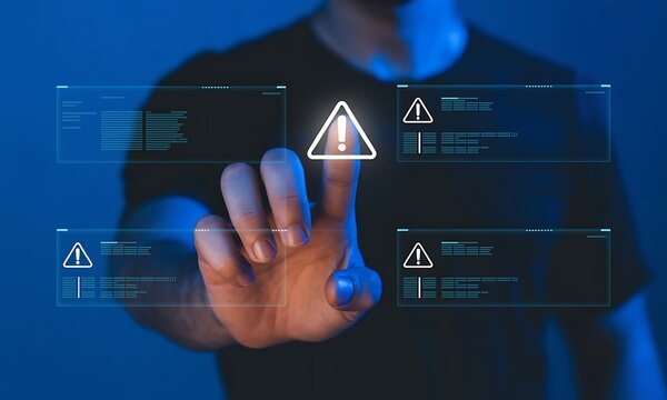 Man interacting with futuristic digital interface displaying warning notifications - Powered by Adobe