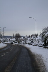 Aberdeen Scotland 6 January 2025 Snow covered main road with in a snowy neighbourhood background