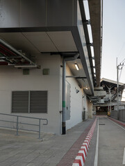 Elevated Monorail System and Electrical Substation Building in Urban City.
