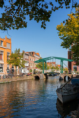 Fototapeta premium The Kerkbrug Bridge Rhine River Oude Rijn Leiden Netherlands.The Kerkbrug bridge in Leiden, Netherlands over the river Oude Rijn. 