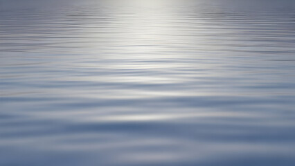 Abstract close-up of smooth gentle blue water surface ripples at sunset