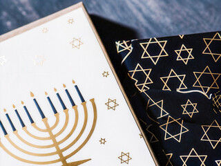 a black and white book with a gold menorah on it