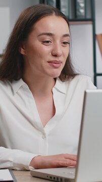 Happy business woman working on laptop computer at home office desk talk on online communication video call with employee, boss. Manager lady freelancer support services looking at webcam of computer