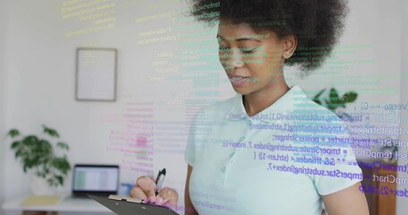 Reviewing clipboard and code overlay, woman working in home office in light polo, copy space