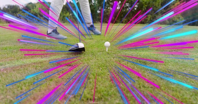 Golfer positioning driver head behind golf ball on tee at golf course, wearing blue-gray golf shoes - Powered by Adobe