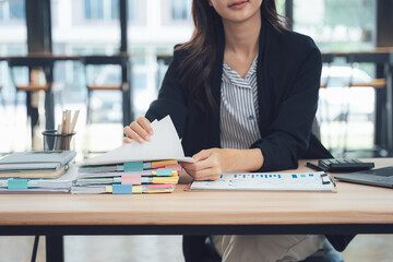 Meticulous Management: A focused professional meticulously organizes files, reflecting precision and dedication within a structured office setting.