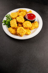 Naklejka premium Chicken nuggets fast food natural tasty appetizer fresh delicious gourmet food background on the table rustic top view copy space