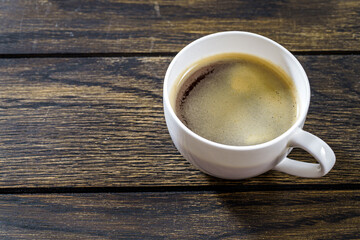 Coffee cup on wooden table