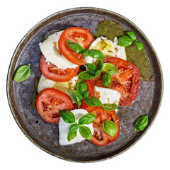 Classic Caprese salad with fresh tomatoes mozzarella and basil above isolated