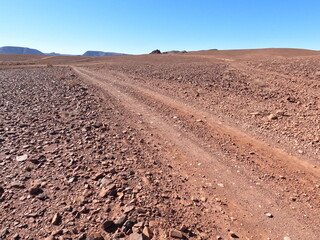 Dirt Road Through Desert Landscape