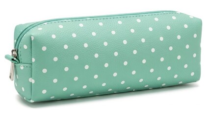 Green polka dot cosmetic bag with compact rectangular shape isolated