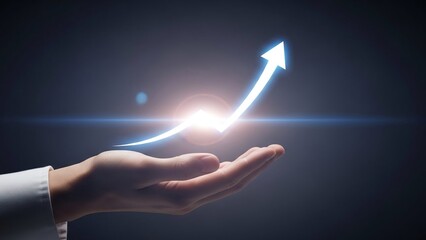 Hand holding a bright white glowing arrow symbolizing business growth, potential, and future success.