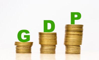 economic growth and gdp concept with ascending gold coin stacks and green letters on light background