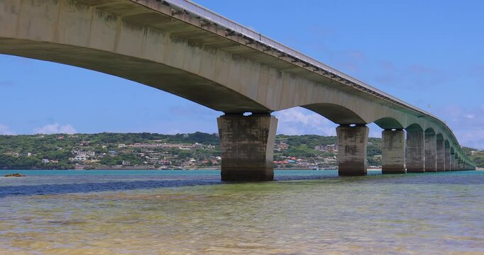 Kouri Bridge spanning the clear, emerald-green sea
