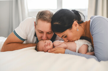 Fototapeta premium family couple with cute newborn baby indoors