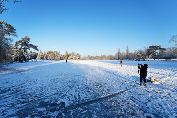 Ice and snow on the Daumesnil lake in the 12th arrondissement of Paris city