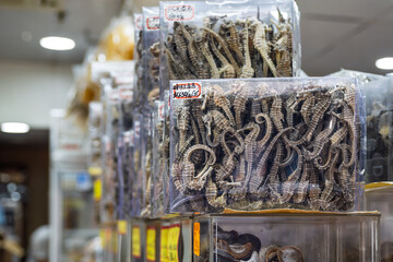 Dried seahorses displayed for sale in a shop. Traditional Asian food ingredient used in Chinese cuisine and herbal medicine