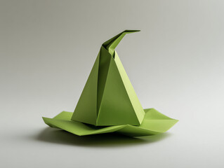 Green origami wizard hat in paper craft style represents creative magic and fantasy [with copy space]