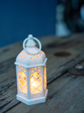 Ramadan Kareem greeting photo of beautiful Arabic lantern and flowers in the background representing the Islamic Holy Month.  