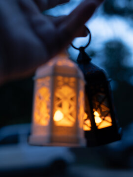 Ramadan Kareem greeting photo of beautiful Arabic lantern and flowers in the background representing the Islamic Holy Month.  